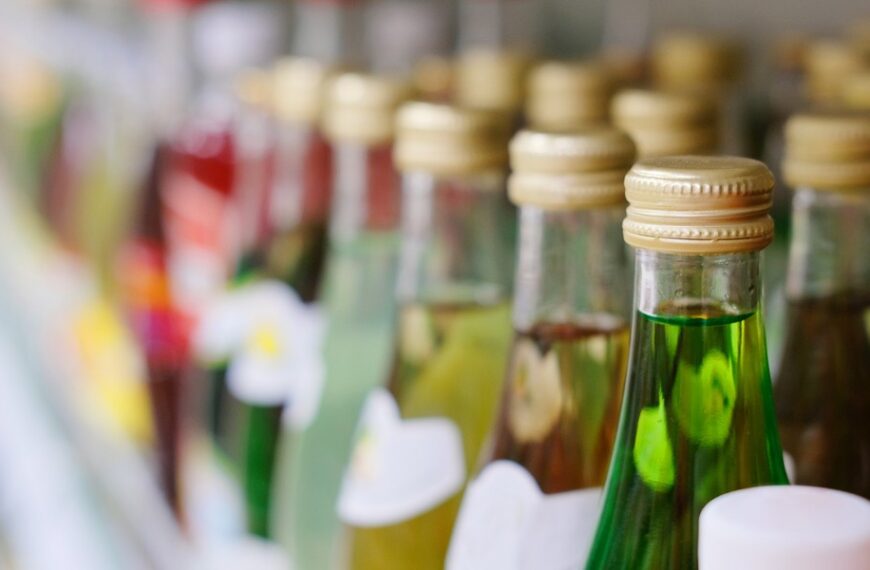 Sports Hero’s Image on Moonshine Bottles: Kin Sues
